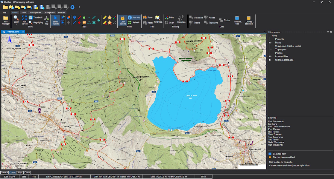 OkMap Desktop 20.0.0 with a redesigned dark-mode interface and a hiking map of Lake Vico.